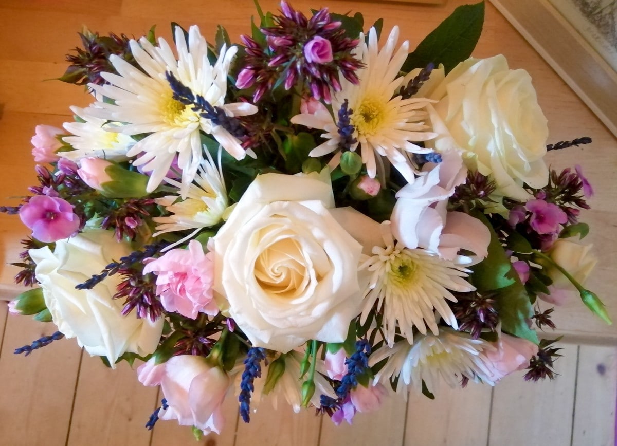Flowers from friends - a beautiful bunch of roses, carnations and other flowers in cream, pinks and purples
