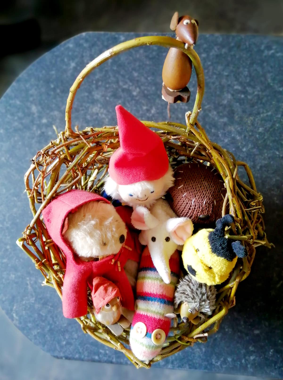 Photoof small, soft, cuddly toys in my hand made woven willow basket