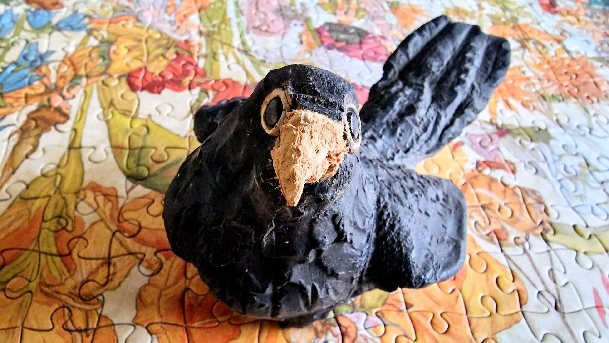 Beaky Blackbird portrait - a close up photo of the pottery blackbird with its paper mache beak